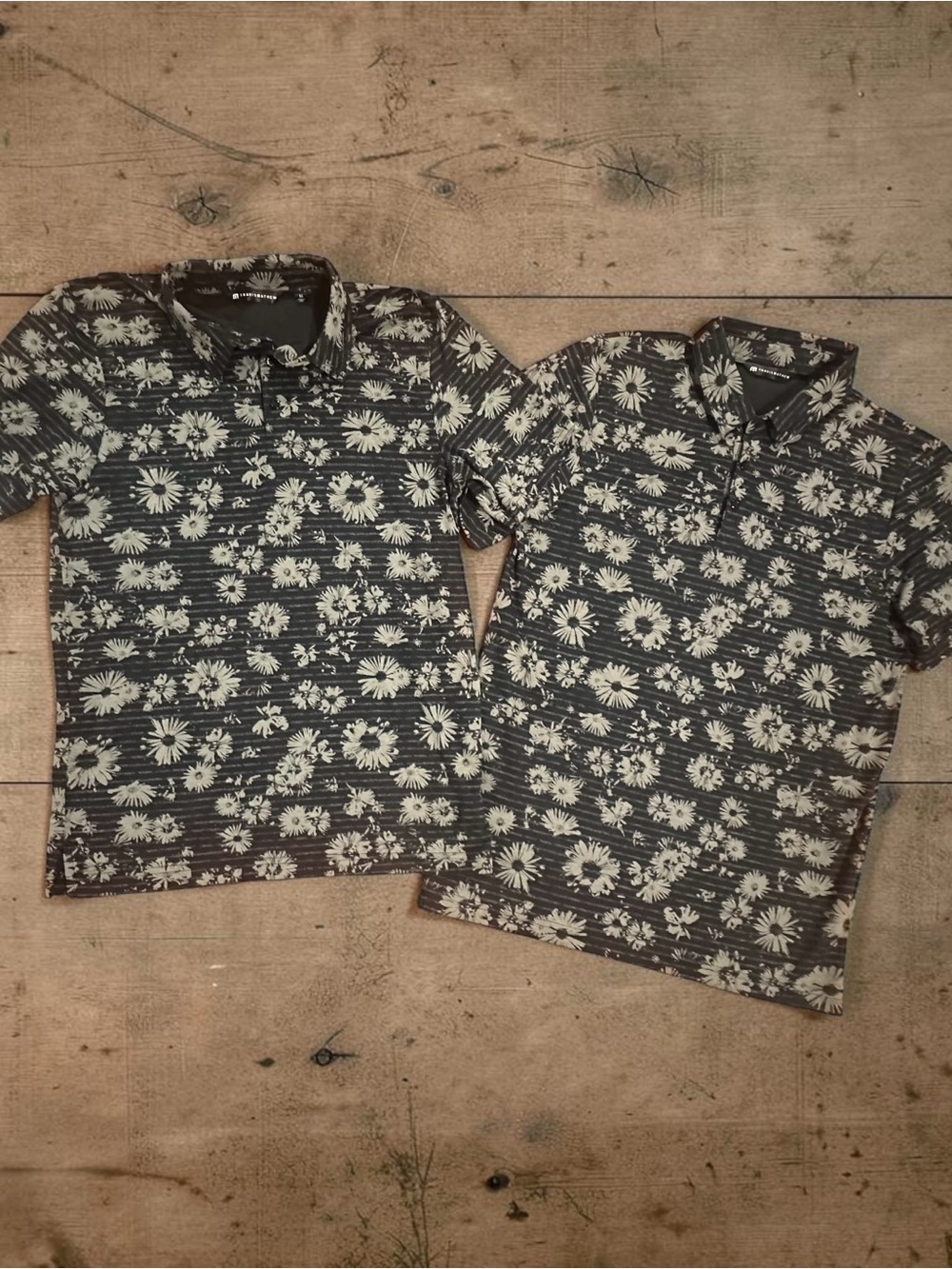 Pair of Travis Mathew Black & Tan Floral Stripe Polo Style Golf Shirts